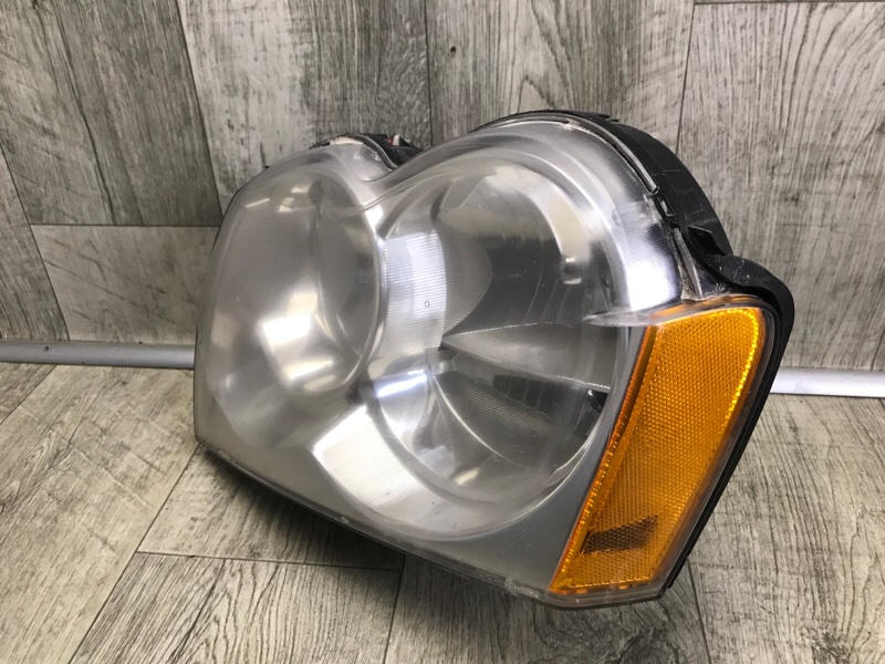 Фара левая JEEP GRAND CHEROKEE 04-10