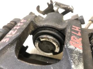 Суппорт тормозной задний левый GRAND CARAVAN 08-