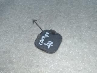 Заглушка буксировочного крюка передняя CAMRY 40 06-11